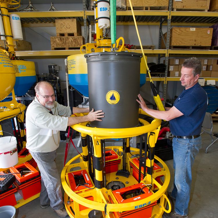 Bruce Keafer and Jim Dunn assembling an ESP unit for shipment. (Photo by Tom Kleindinst, Woods Hole Oceanographic Institution)